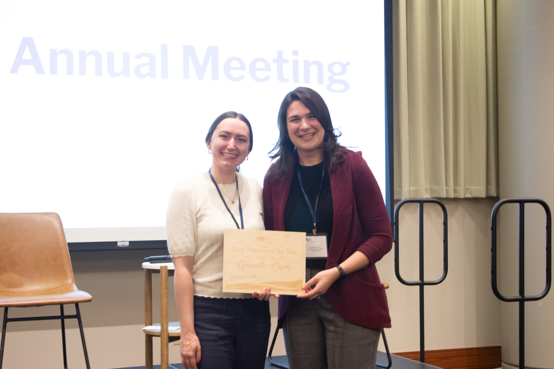 Lily Gordon presenting Danielle Capers the outstanding new members award.